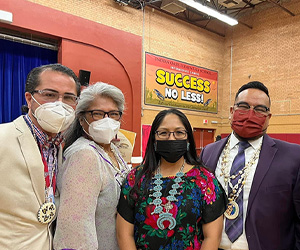 Five happy board members wearing face masks
